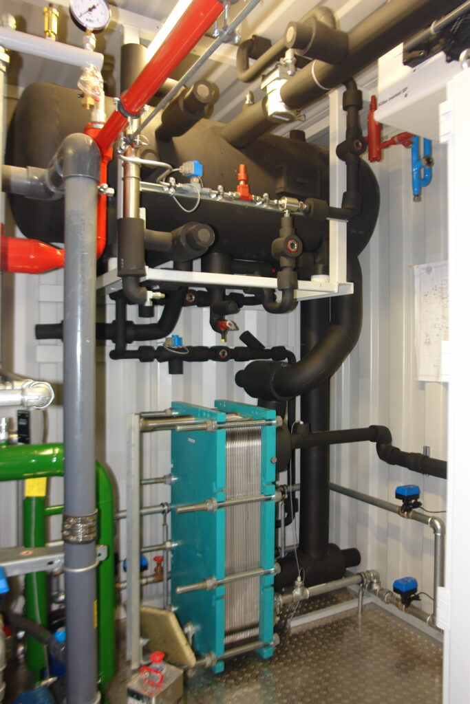 Interior view of an ammonia chiller with plate evaporator and refrigerant separator.