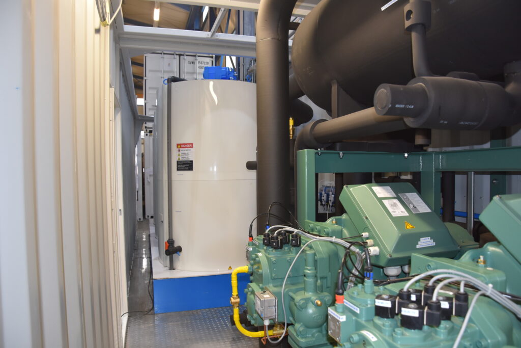 Inside view to the ice makers and compressors of a flake ice plant