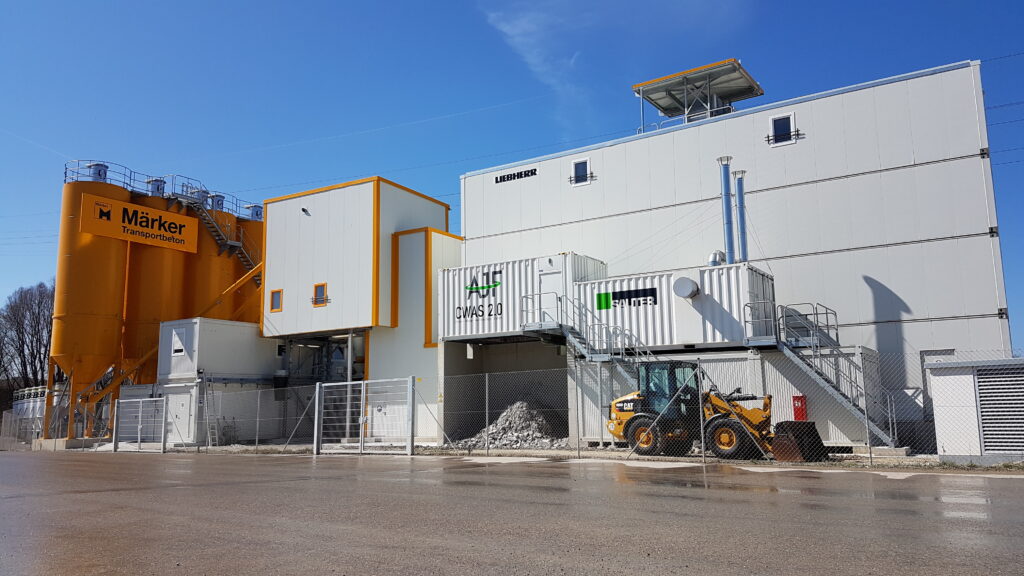 KTI - SAUTER hot air unit installed for silo heating in container in front of ready-mix concrete plant.