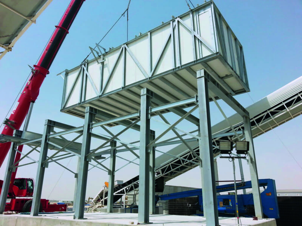An ice storage facility with a capacity of 120 tons of ice is lifted onto a galvanized steel foundation.