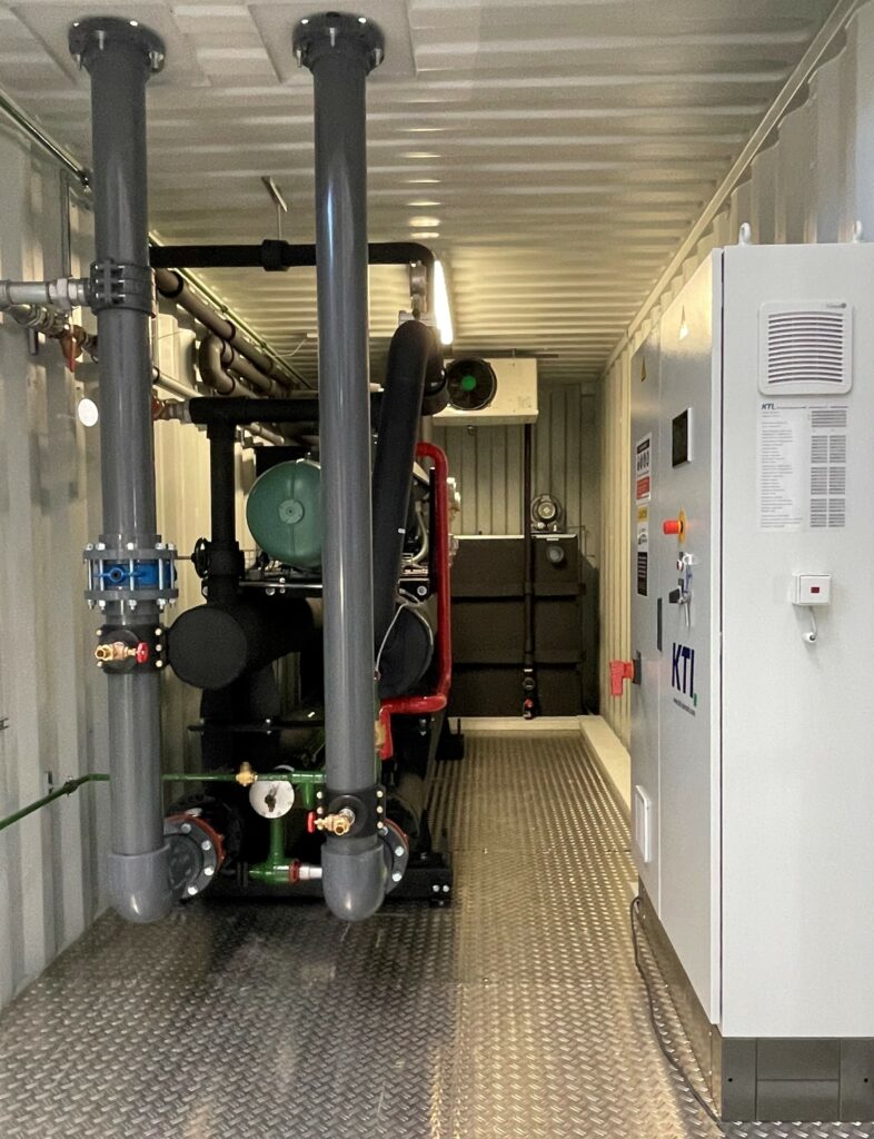 Interior view of an ice water plant with multi-stage cooling of the water. The ice water basin can be seen in the background.