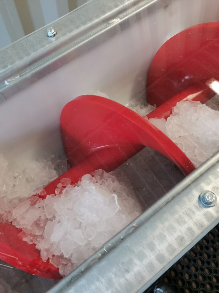 Plate ice during weighing process in weighing screw in food grade liner.